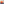         Die orange Pilzlampe steht auf einem blauen Design-Beistelltisch neben einem weißen Sofa mit cremefarbenen Kissen. Das kräftige Orange der Lampe setzt einen markanten Kontrast zur minimalistischen Einrichtung.